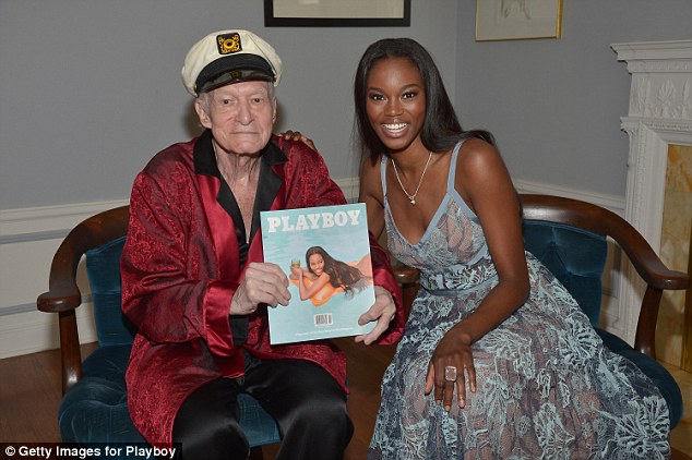 God Hugh Hefner tweets pic of himself and wife Crystal settling down for movie night at the Playboy mansion after 'death bed' rumors